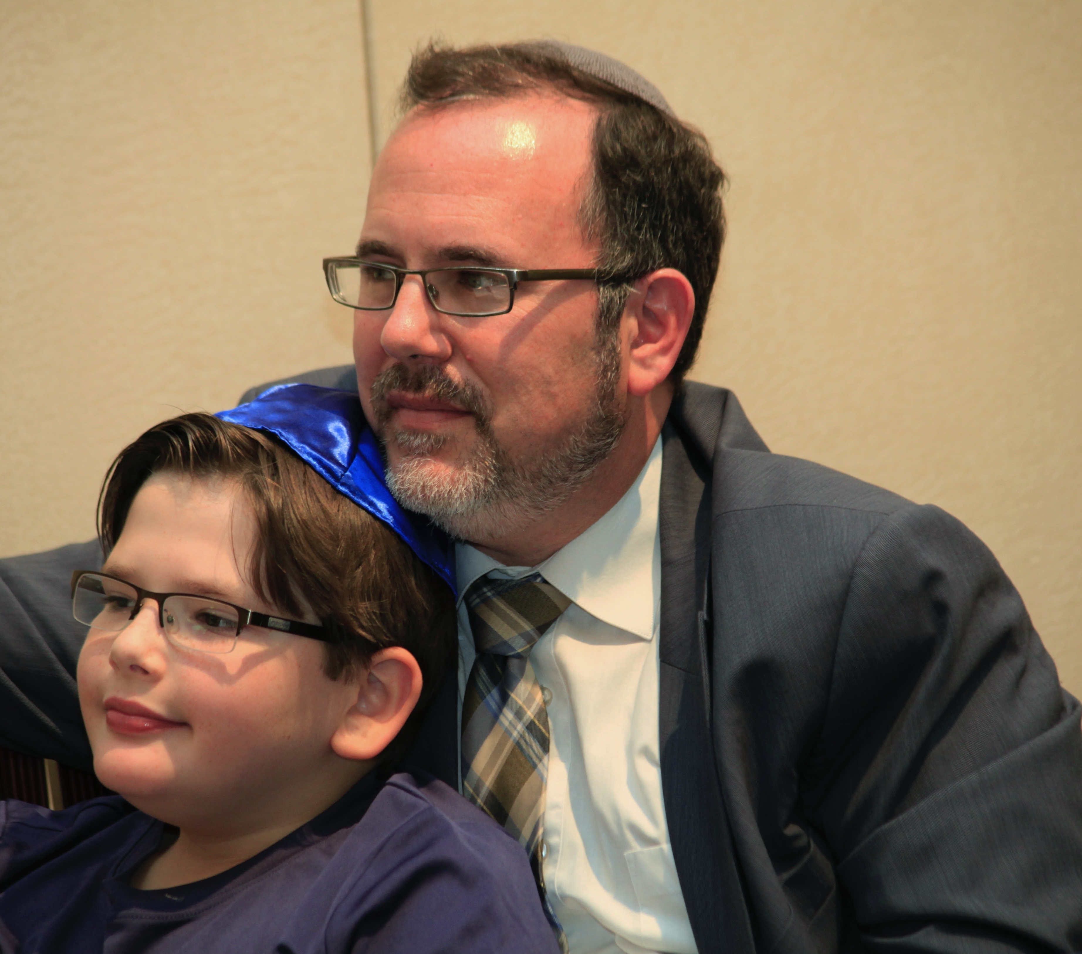Rabbi David Fine and his son enjoying Betsy Teutsch's presentation about global tikkun olam