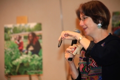 Betsy Teutsch holds up a simple device used to purify water