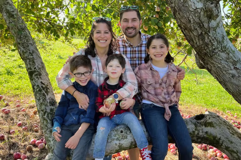Young Family Picking Apples as part of early childhood activities at Temple Israel in New Jersey.